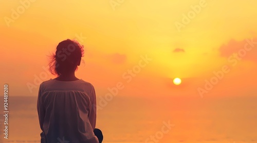 silhouette of a person meditating at sunset