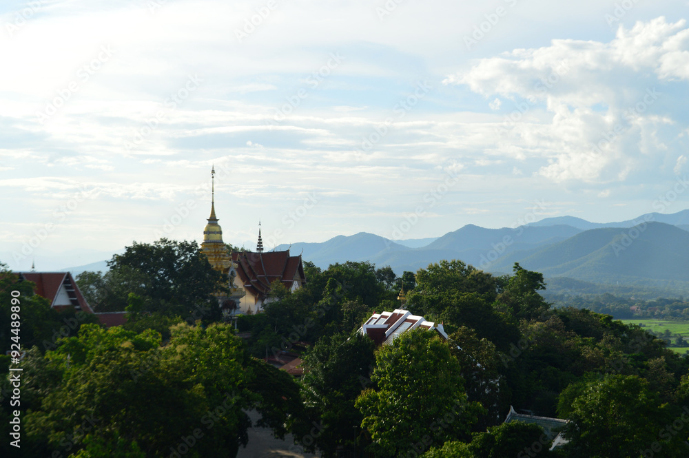 Fototapeta premium Golden pagoda Lanna Architecture , Symbols of Buddhism, South East Asia and Beautiful Sunset Sky and Landscape at Wat Phra That Doi Saket temple Chiang Mai ,Northern Thailand