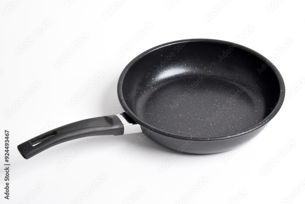 Black frying pan with a non-stick coating isolated on white background Black frying pan with a non-stick coating isolated on white background