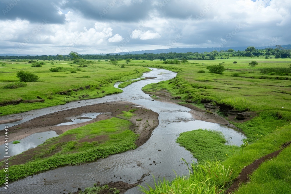 A river monsoon landscape features enriched soil, showcasing the impact of seasonal rains on the riverbanks and surrounding terrain. A river monsoon landscape features enriched soil, showcasing the impact of seasonal rains on the riverbanks and surrounding terrain.