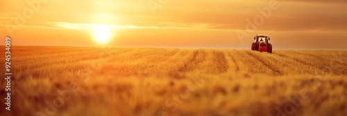 A stunning sunset over expansive farmland with a tractor at work, representing the diligence and tireless effort in the agricultural sector. photo