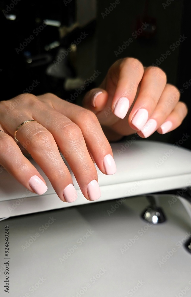 The beauty of the natural nails. Perfect clean manicure. New trendy nail arts on young women hand The beauty of the natural nails. Perfect clean manicure. New trendy nail arts on young women hand