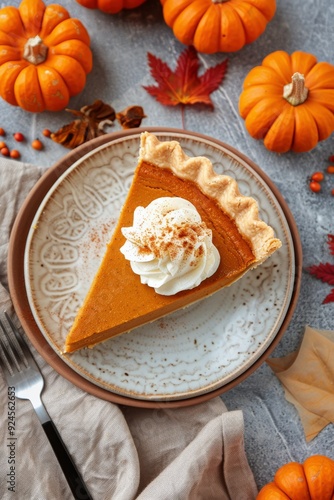 Delicious Slice Of Pumpkin Pie Topped With Whipped Cream Surrounded By Mini P...