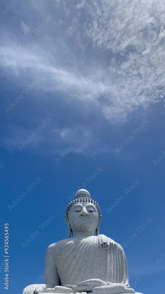 Big buddha statue Phuket Thailand.Panorama view of Buddha statue closeup with selective focus and blur.Golden Buddha statue with blue sky.Recliner buddha Thailand.Famous tourist attraction of Phuket. Big buddha statue Phuket Thailand.Panorama view of Buddha statue closeup with selective focus and blur.Golden Buddha statue with blue sky.Recliner buddha Thailand.Famous tourist attraction of Phuket.