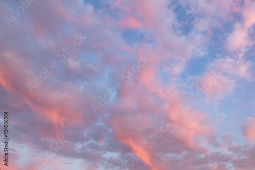 Fototapeta Naklejka Na Ścianę i Meble -  Pretty pink clouds against a blue sky at sunset