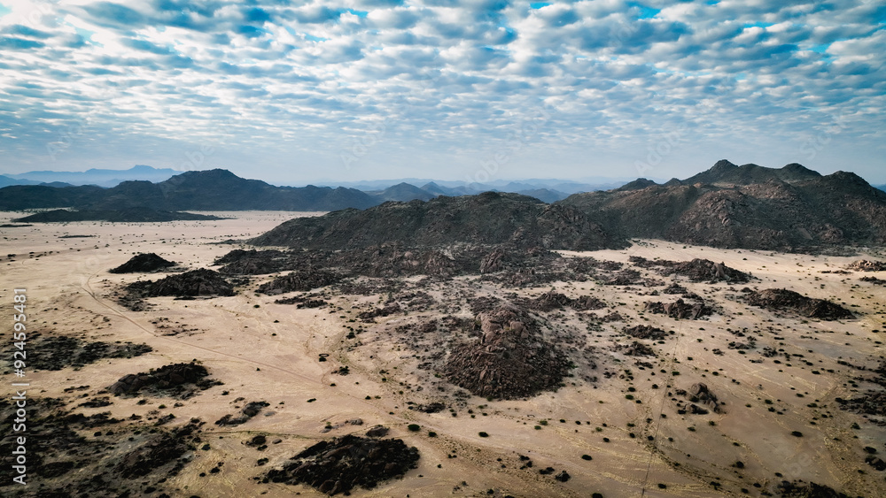 Vast landscape of Iona National Park in Angola showcasing rocky terrains and unique cloud formations Vast landscape of Iona National Park in Angola showcasing rocky terrains and unique cloud formations