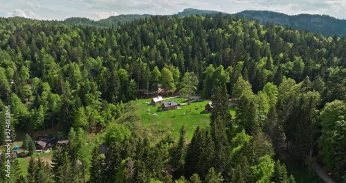 Mendola Aerial View Charming Alpine Village in the Dolomite Mountains, Italy, with Houses on Forested Slopes. High quality 4k footage photo