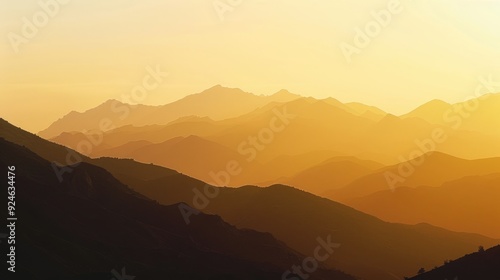 Silhouetted mountain range against golden sky