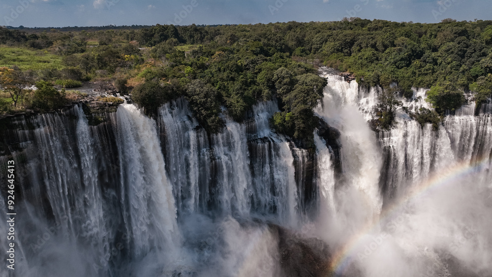 Kalandula Waterfall cascading through lush greenery in Angola during daylight Kalandula Waterfall cascading through lush greenery in Angola during daylight