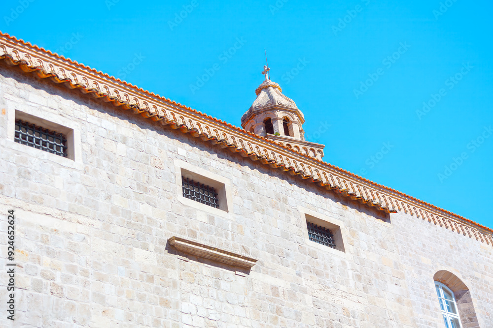 Historic building showcasing its architectural elegance. Building is made of stone and has window