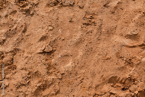 Background of beige, brown beach sand with natural pattern background. top view, flat lay. copy space, close up