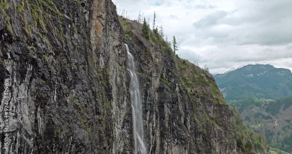 Aerial Drone View of a Gorgeous Waterfall in the Dolomite Alps, Italy: Spectacular Mountain River Flowing Down Steep Rock Faces in a Picturesque Nature Scene. High quality 4k footage Aerial Drone View of a Gorgeous Waterfall in the Dolomite Alps, Italy: Spectacular Mountain River Flowing Down Steep Rock Faces in a Picturesque Nature Scene. High quality 4k footage