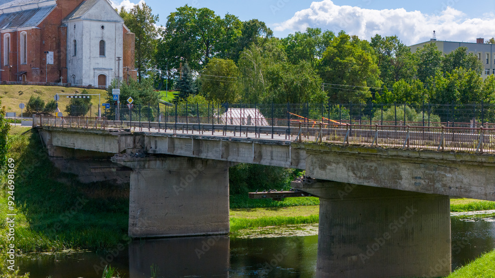 Fototapeta premium Kedainiai Bridge over the Nevezis River – partially collapsed with one beam down, one lane in use, major reconstruction planned Aug 13 2014