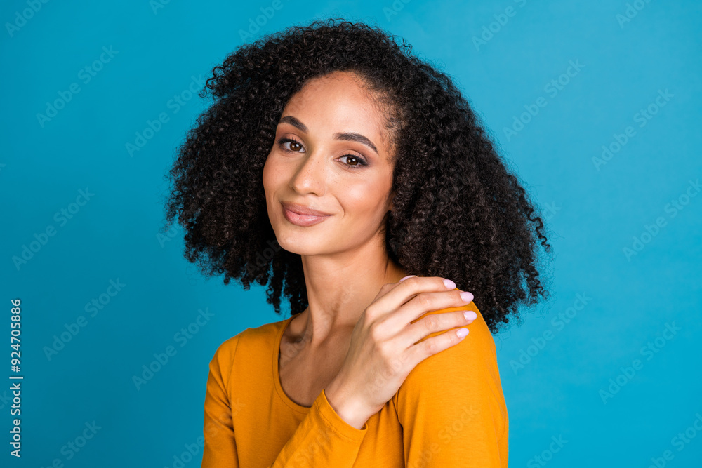 Fototapeta premium Photo portrait of pretty young girl cuddle self comfortable wear trendy yellow outfit isolated on blue color background
