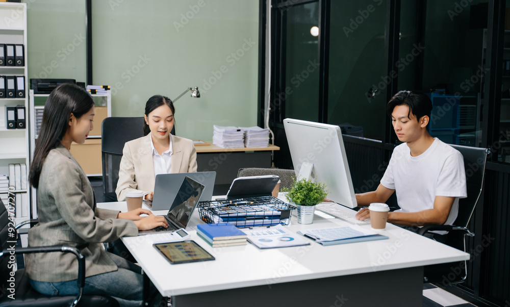 Business team discuss at meeting room. working together with laptop ,tablet and smart phone on desk Financial Business team discuss at meeting room. working together with laptop ,tablet and smart phone on desk Financial