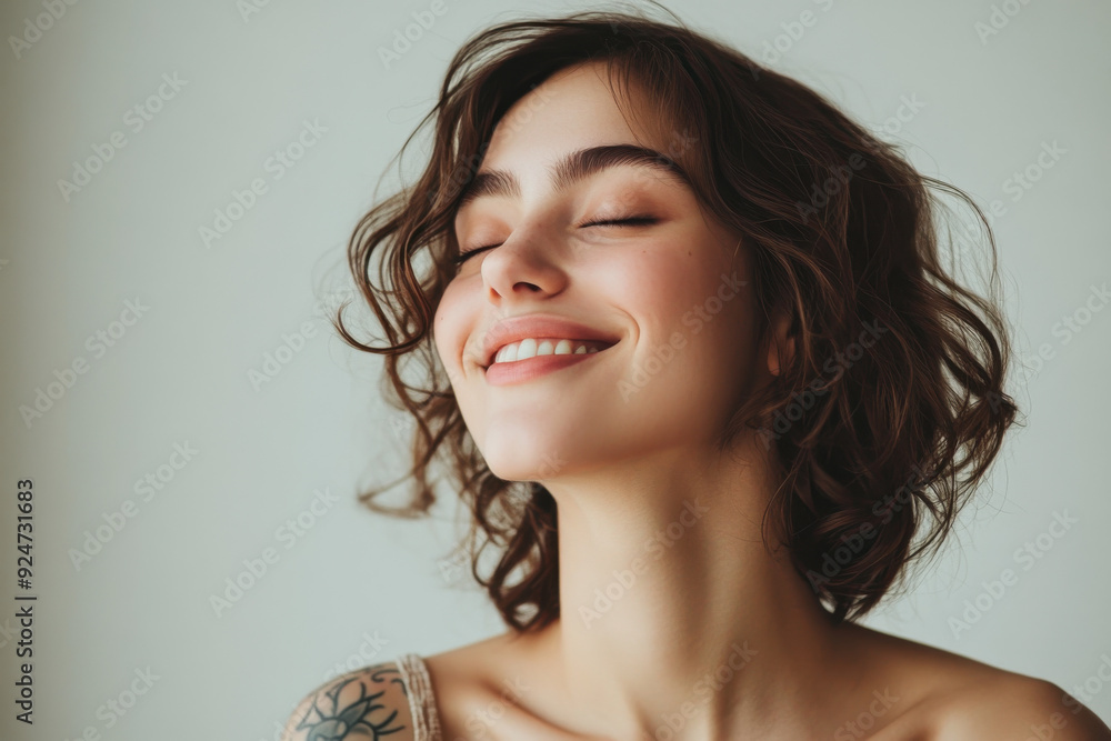 A close up of a woman's face with tattoos and her eyes closed A close up of a woman's face with tattoos and her eyes closed