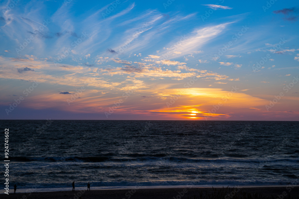 Fototapeta premium Sunset on the beach of Denmark to the North Sea between dunes