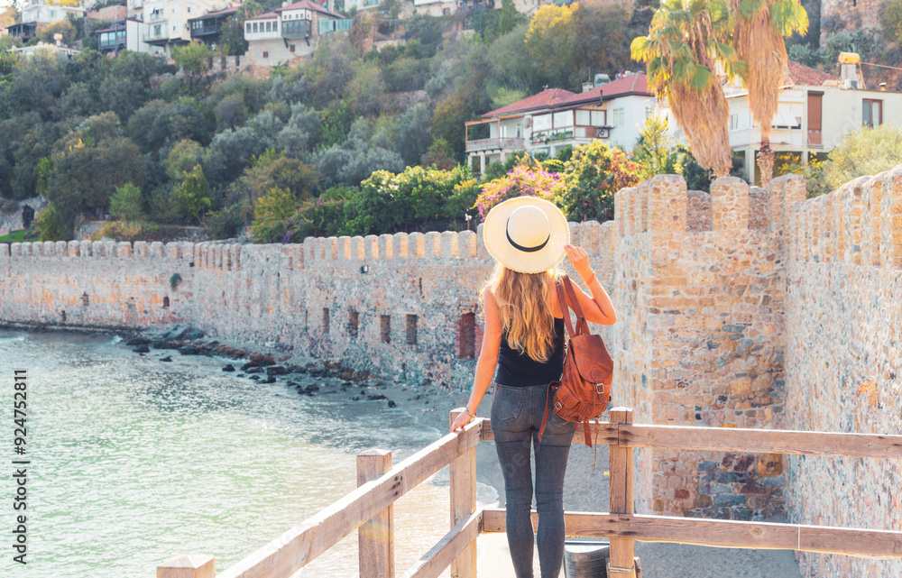 Fototapeta premium tourist woman traveling in Turkey, Antalya, red tower in Alanya