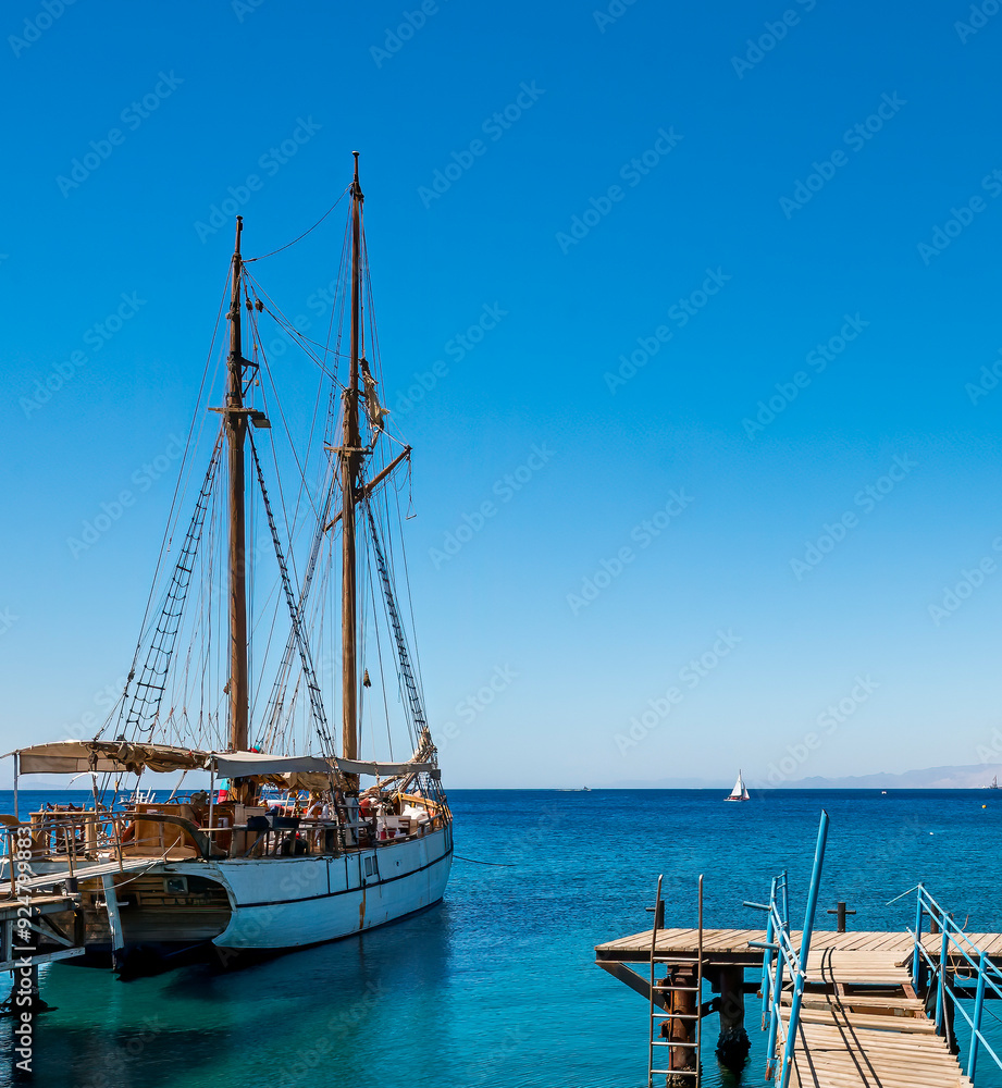 Pleasure yachts and sailboats anchored in marina of the Red Sea in Eilat – famous tourist resort and recreational city in Israel
Pleasure yachts and sailboats anchored in marina of the Red Sea in Eilat – famous tourist resort and recreational city in Israel