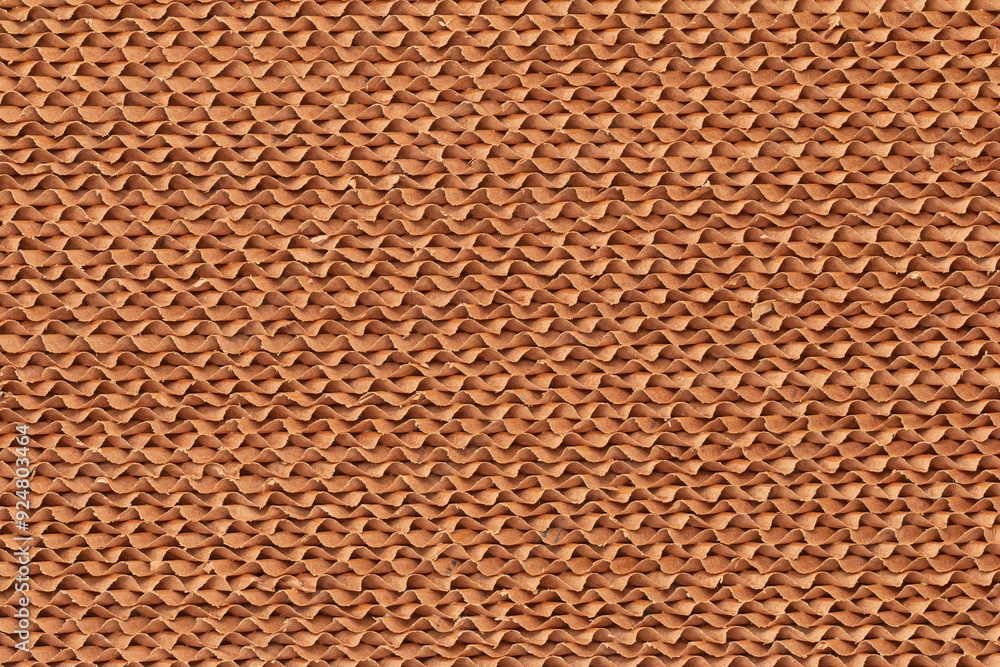 Abstract, The evaporative-cooling-pad paper image shows a repeating textured pattern made up of overlapping curved shapes or waves in a reddish-brown or terracotta color. Abstract, The evaporative-cooling-pad paper image shows a repeating textured pattern made up of overlapping curved shapes or waves in a reddish-brown or terracotta color.