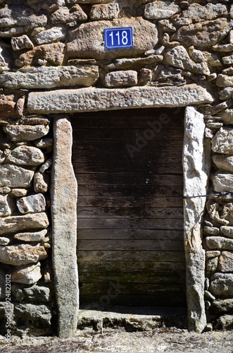 Old wooden door with stone frame