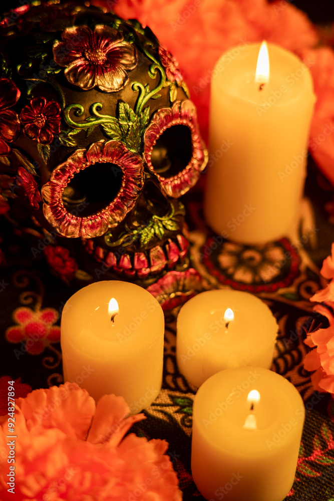 Top view of a decorated skull with metal flowers, surrounded by vibrant orange marigolds and candles Top view of a decorated skull with metal flowers, surrounded by vibrant orange marigolds and candles