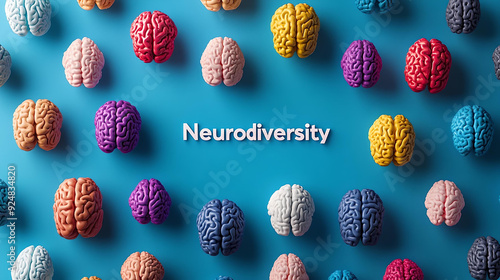 Multiple colorful brain models arranged on a blue background with the word 