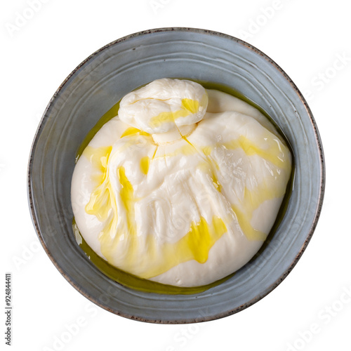 Burrata cheese with olive oil in gray bowl isolated on white background. Top view.