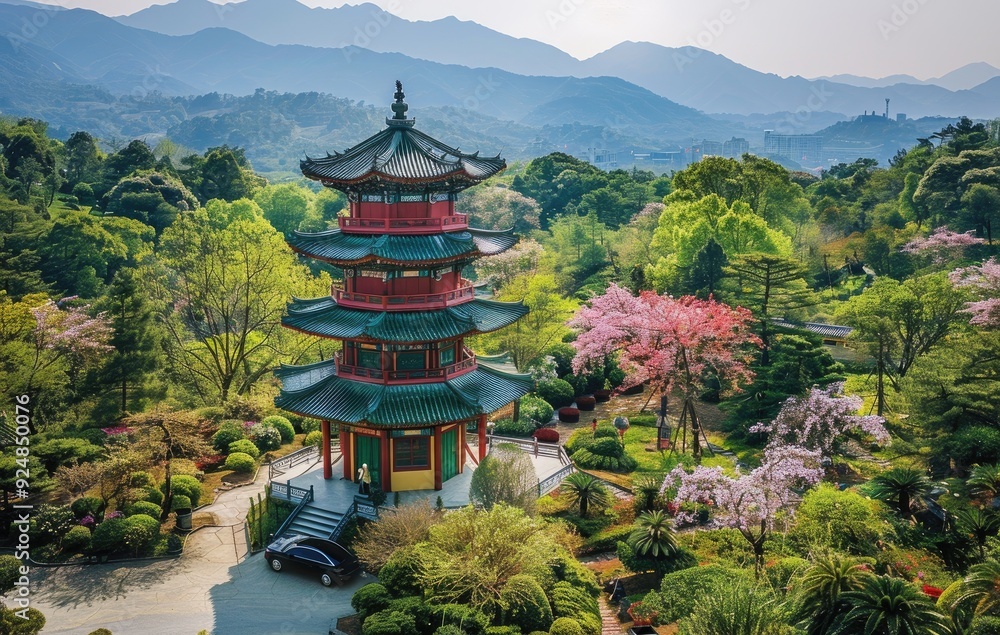 Aerial View of Historic Wooden Watchtower in Lush Tea Mountain Forest at Sunrise. Ancient Red and Green Tower Amidst the Verdant Landscape