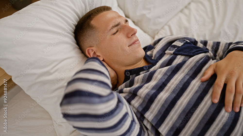 Handsome young hispanic man enjoying a peaceful nap in a cozy indoor bedroom setting, exuding tranquility and rest. Handsome young hispanic man enjoying a peaceful nap in a cozy indoor bedroom setting, exuding tranquility and rest.