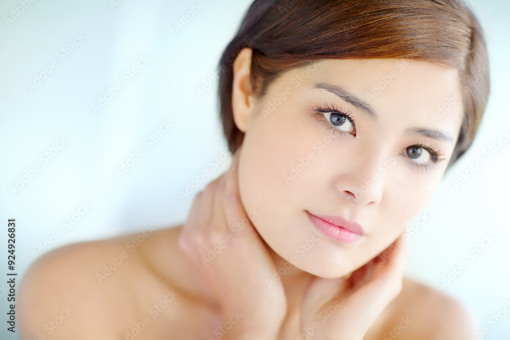 Asian woman, portrait and beauty for skincare, dermatology and model in studio with healthy skin. Female person, face and hygiene routine on blue background for facial treatment, self care and glow Asian woman, portrait and beauty for skincare, dermatology and model in studio with healthy skin. Female person, face and hygiene routine on blue background for facial treatment, self care and glow