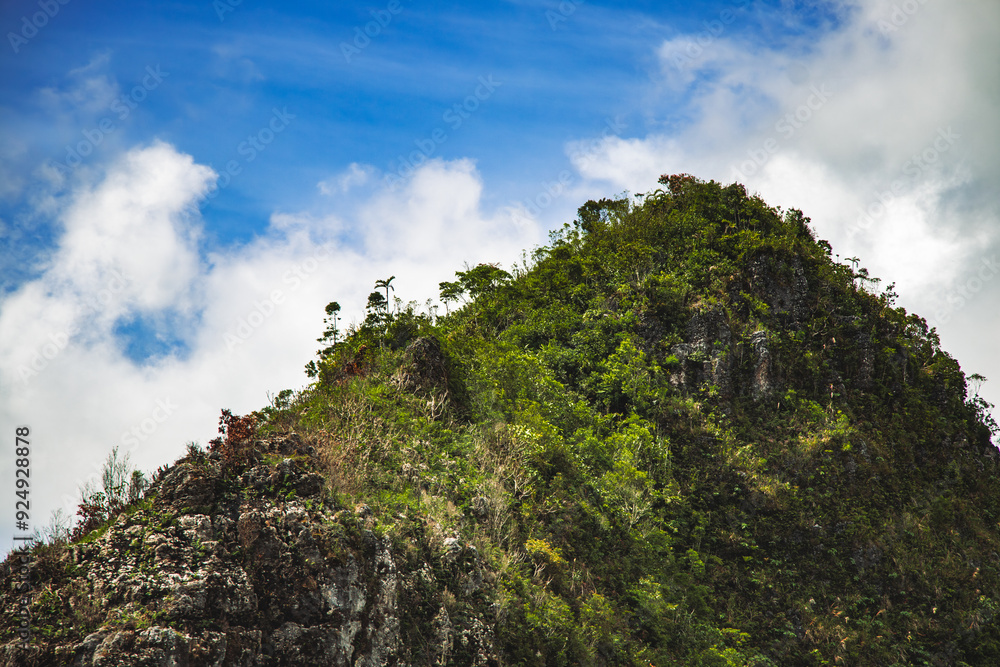 Mountain peak under vibrant blue sky Mountain peak under vibrant blue sky