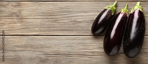 Half cut eggplants on a dis...