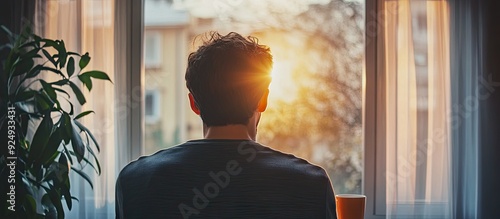 Young man with a cup of dri...