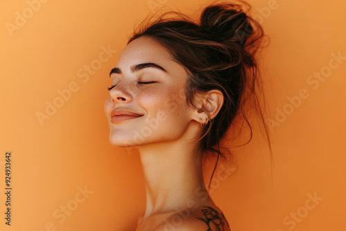 A close up of a woman's face with tattoos and her eyes closed