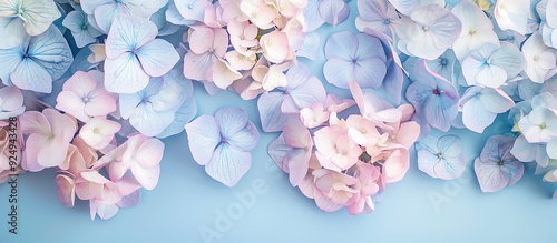 Creative image of pastel blue hydrangea flowers on an artistic ink background Top view with copyspace photo