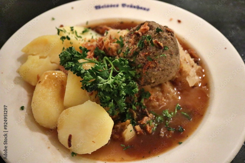 German cuisine: leberknödelsuppe (liver dumpling soup) in Munich, Germany German cuisine: leberknödelsuppe (liver dumpling soup) in Munich, Germany