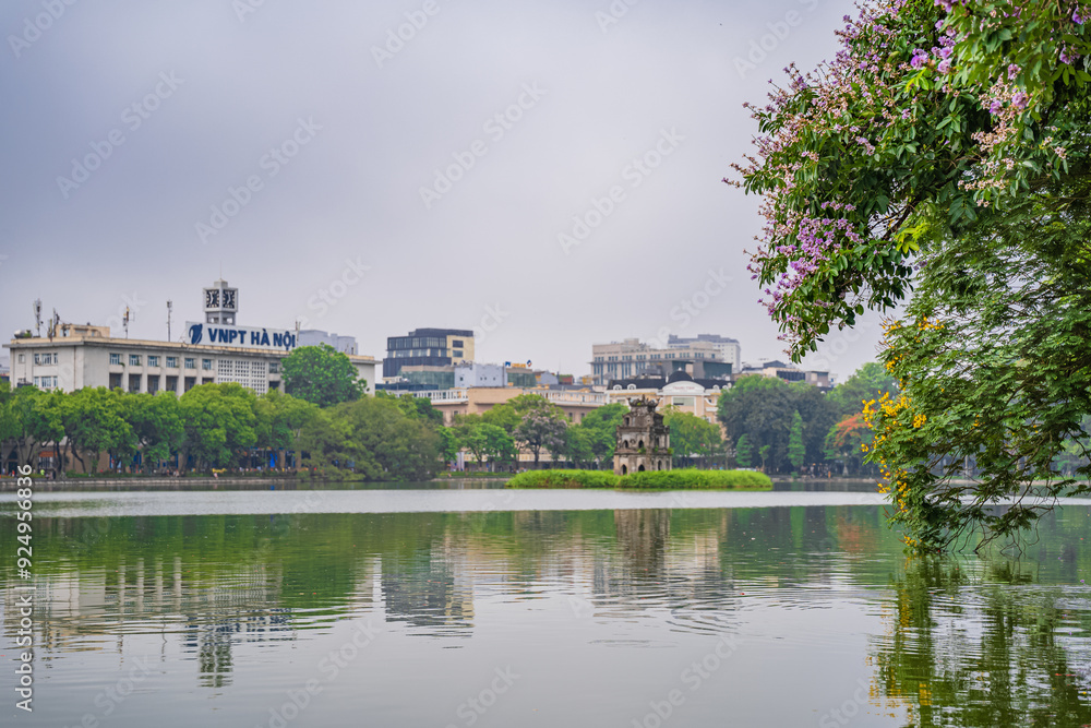 Turtle Tower (Thap Rua) in Hoan Kiem lake (Sword lake, Ho Guom) in Hanoi, Vietnam. Turtle Tower (Thap Rua) in Hoan Kiem lake (Sword lake, Ho Guom) in Hanoi, Vietnam.