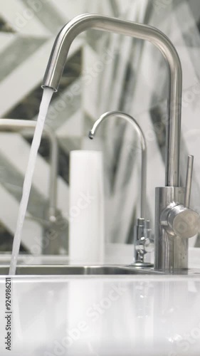 Faucet with flowing water, Concept of clean, drinking water from a faucet. Water contamination and drying up. banner, poster template for selling water purification services.