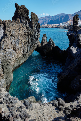 Volcanic rocks at Cueva de la Vaca and the Atlantic Ocean in Santiago del Teide Tenerife Spain