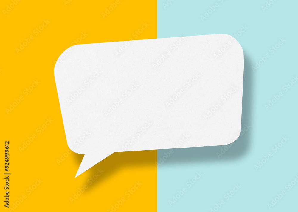 Empty speech balloon shape white paper isolated on yellow-light blue background communication bubbles. Empty speech balloon shape white paper isolated on yellow-light blue background communication bubbles.