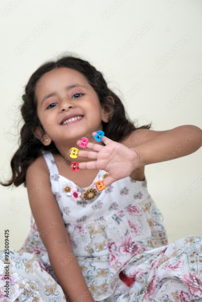 A delightful little girl with sparkling eyes, breaking into a wide, infectious smile. Her expression radiates pure happiness and innocence. A delightful little girl with sparkling eyes, breaking into a wide, infectious smile. Her expression radiates pure happiness and innocence.