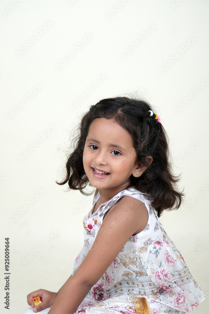 A delightful little girl with sparkling eyes, breaking into a wide, infectious smile. Her expression radiates pure happiness and innocence. A delightful little girl with sparkling eyes, breaking into a wide, infectious smile. Her expression radiates pure happiness and innocence.