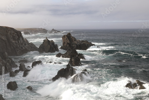 A rocky shoreline on the Atlantic Ocean  in The Dungeon Provincial Park, Bonavista Peninsula Newfoundland and Labrador, Canada. photo