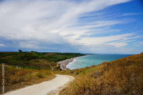 Mountain road heading to the sea in a summer day, Punta Aderci natural reserve, Abruzzo, Italy