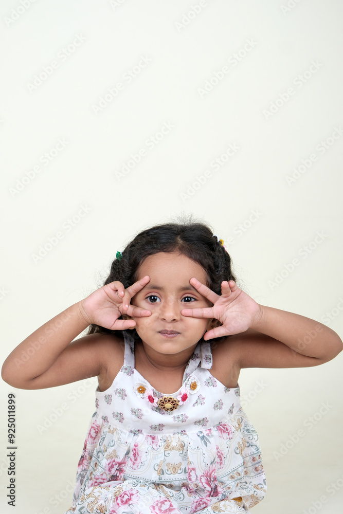 A delightful little girl with sparkling eyes, breaking into a wide, infectious smile. Her expression radiates pure happiness and innocence. A delightful little girl with sparkling eyes, breaking into a wide, infectious smile. Her expression radiates pure happiness and innocence.