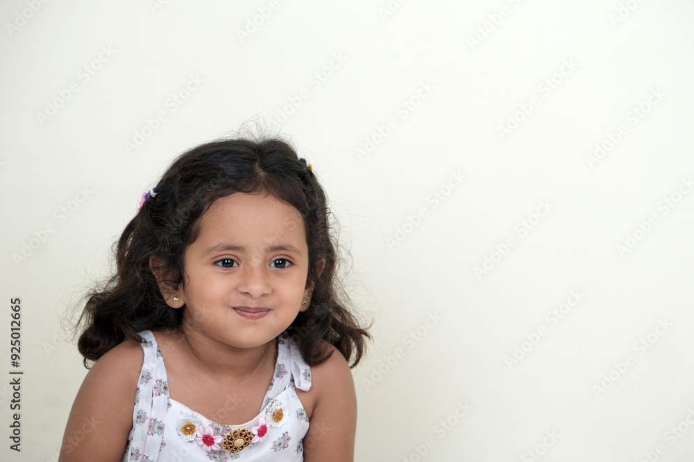 A delightful little girl with sparkling eyes, breaking into a wide, infectious smile. Her expression radiates pure happiness and innocence. A delightful little girl with sparkling eyes, breaking into a wide, infectious smile. Her expression radiates pure happiness and innocence.