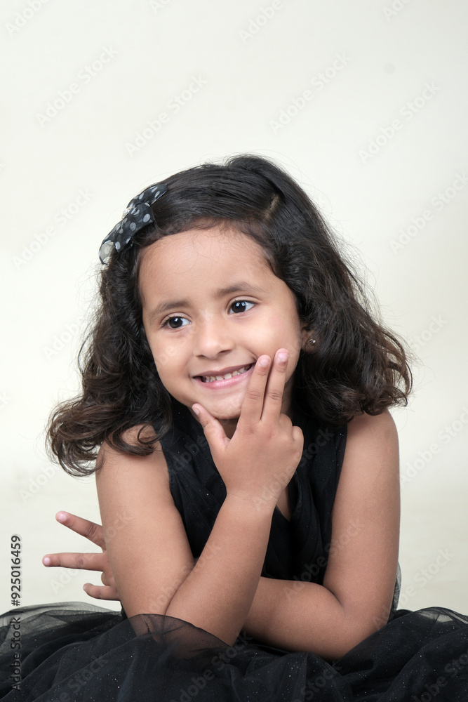 A delightful little girl with sparkling eyes, breaking into a wide, infectious smile. Her expression radiates pure happiness and innocence. A delightful little girl with sparkling eyes, breaking into a wide, infectious smile. Her expression radiates pure happiness and innocence.