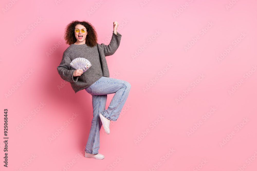 Full size photo of attractive young woman sunglass money fan celebrate win dressed stylish gray clothes isolated on pink color background Full size photo of attractive young woman sunglass money fan celebrate win dressed stylish gray clothes isolated on pink color background