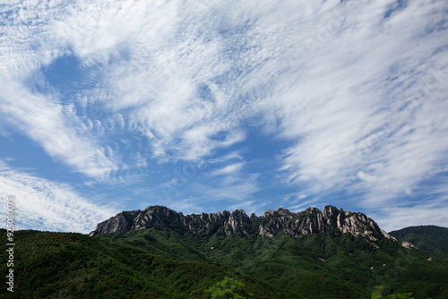 Low angle and summer view of peaks of Ulsanbawi Rock against blue sky in summer at Seoraksan Mountain near Goseong-gun, Gangwon-do, South Korea photo